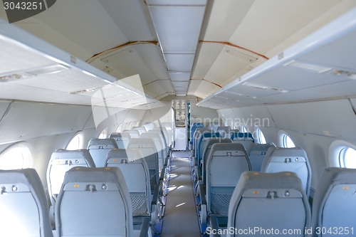 Image of Interior of an airplane with many seats