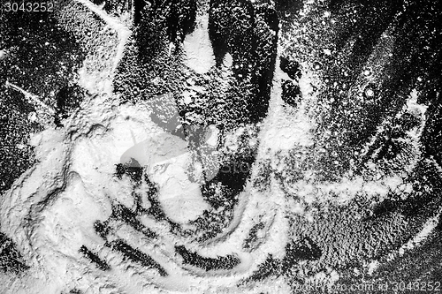 Image of White flour on black background