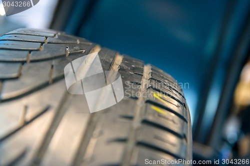 Image of New car tyre closeup photo