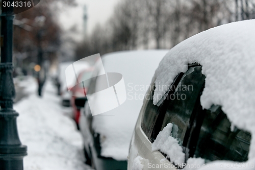 Image of Cars covered in snow after blizzard