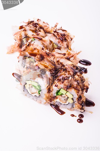 Image of eel sushi roll in tuna flakes 