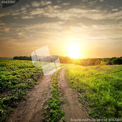 Image of Sunset over country road