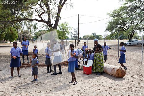 Image of Happy Namibian school children waiting for a lesson.