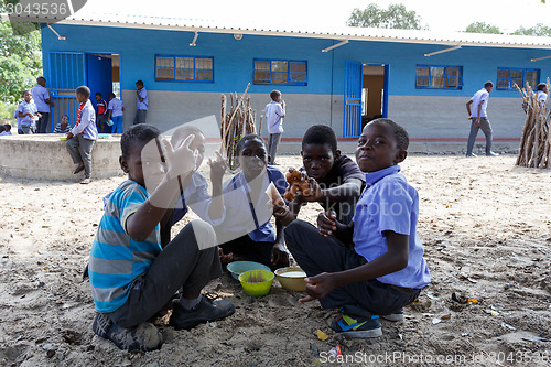 Image of Happy Namibian school children waiting for a lesson.