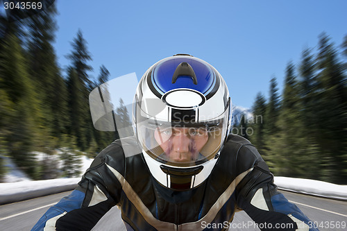 Image of Motorcyclist on mountain road