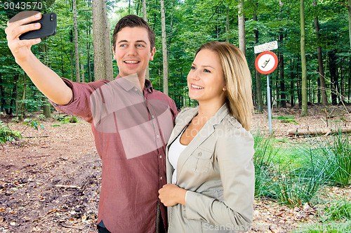 Image of Couple taking a selfie in a No Cell phone area