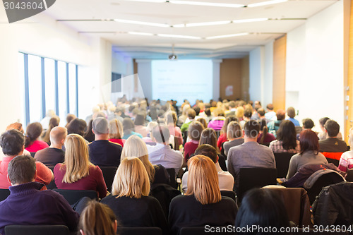 Image of Speaker at Business Conference and Presentation.