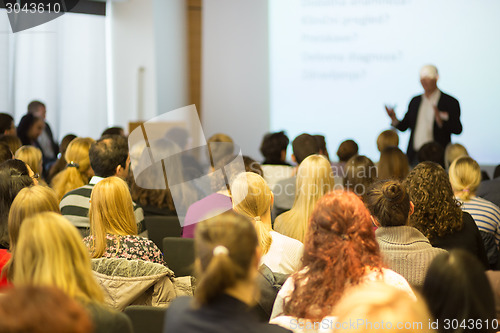 Image of Speaker at Business Conference and Presentation.