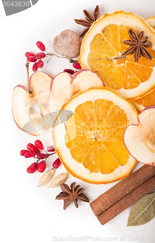 Image of Christmas spices and dried orange sliceson 