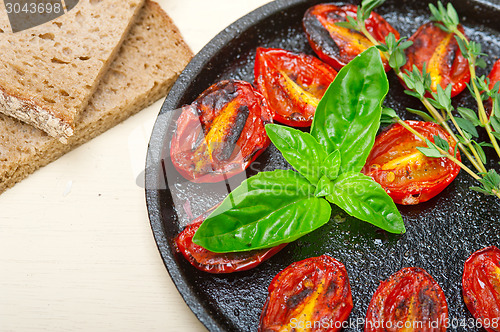 Image of baked cherry tomatoes with basil and thyme