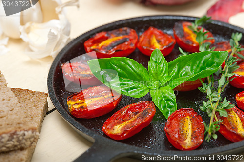 Image of baked cherry tomatoes with basil and thyme