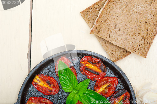 Image of baked cherry tomatoes with basil and thyme