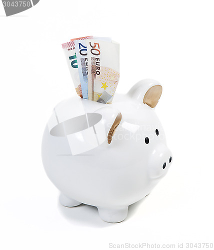 Image of piggy bank with money bills