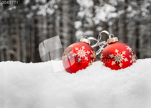 Image of Two christmas balls in snow