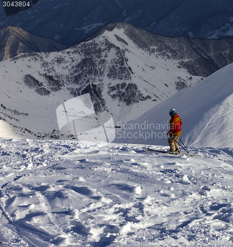 Image of Skier on off-piste slope in sunny evening