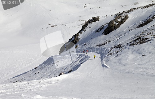 Image of Snowboarders and skiers on ski slope