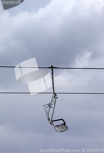 Image of Chair-lift and gray sky