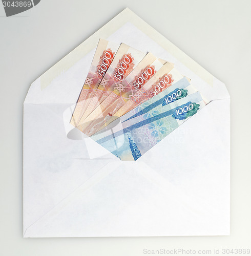 Image of Ruble money in white envelope 