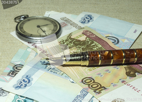 Image of Pocket watches, notebook and money