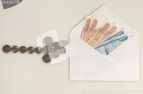 Image of Coins arrow points to envelope with money