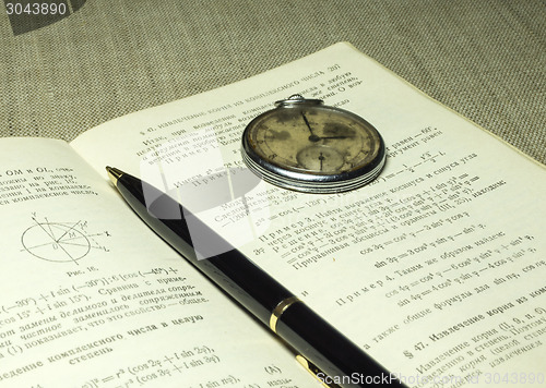 Image of Classbook, pen and old watches