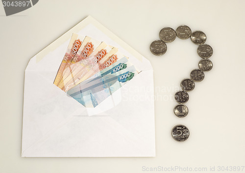 Image of Money in envelope and question mark from coins