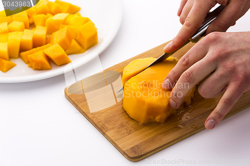 Image of Cutting The Middle Mango Third Containing Its Pit