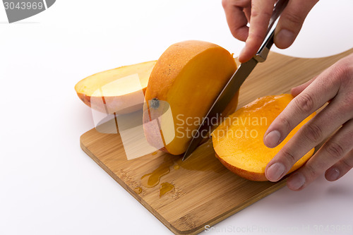 Image of Last Third Of A Mango Cut Off Along Its Fruit Pit