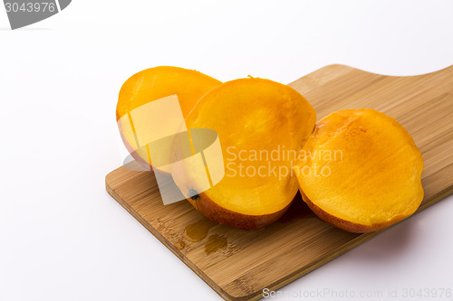 Image of Mango Cut Into Three Equal Slices