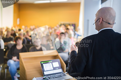 Image of Speaker at Business Conference and Presentation.