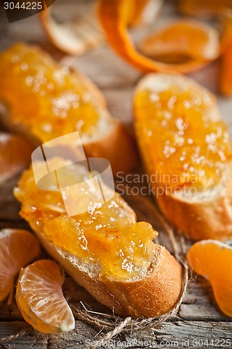 Image of pieces of baguette with orange marmalade