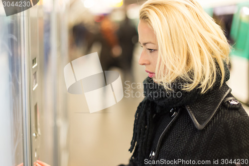 Image of Lady buying ticket for public transport.