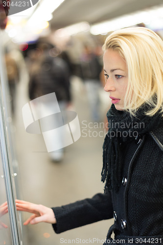 Image of Lady buying ticket for public transport.