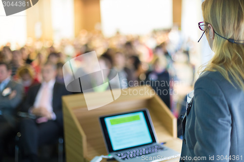 Image of Speaker at Business Conference and Presentation.