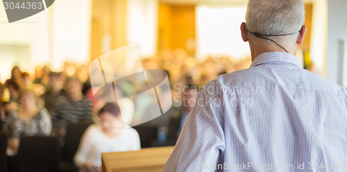 Image of Speaker at Business Conference and Presentation.