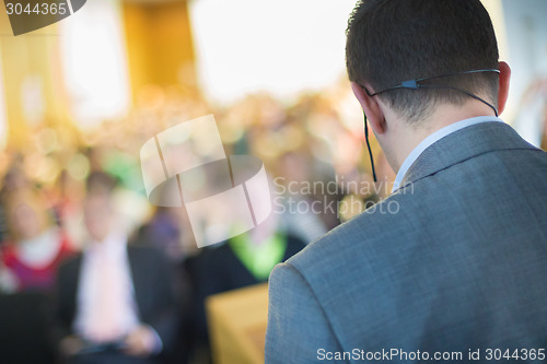 Image of Speaker at Business Conference and Presentation.