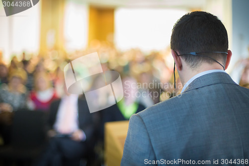 Image of Speaker at Business Conference and Presentation.