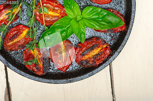 Image of baked cherry tomatoes with basil and thyme