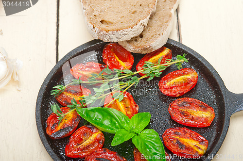 Image of baked cherry tomatoes with basil and thyme