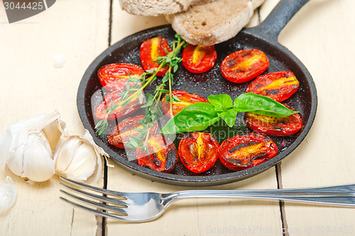 Image of baked cherry tomatoes with basil and thyme