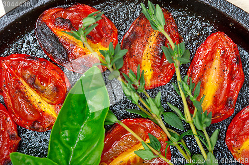 Image of baked cherry tomatoes with basil and thyme