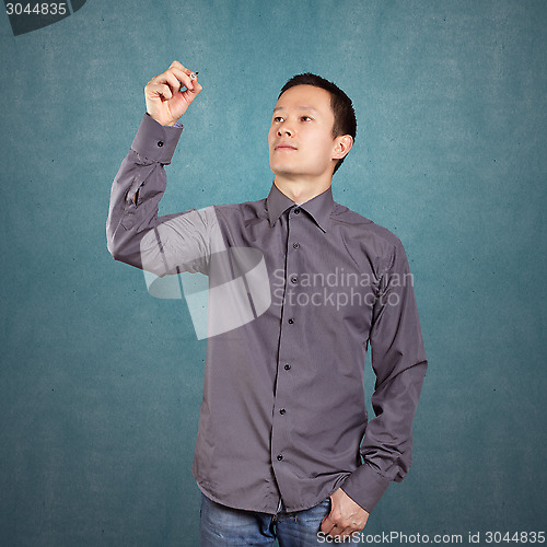 Image of Asian Man Writing Something