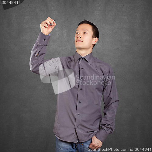 Image of Asian Man Writing Something