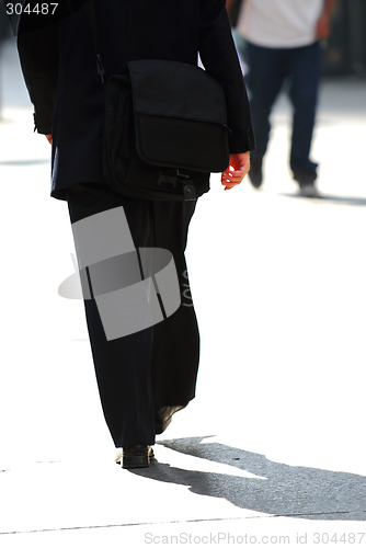 Image of Businessman walking