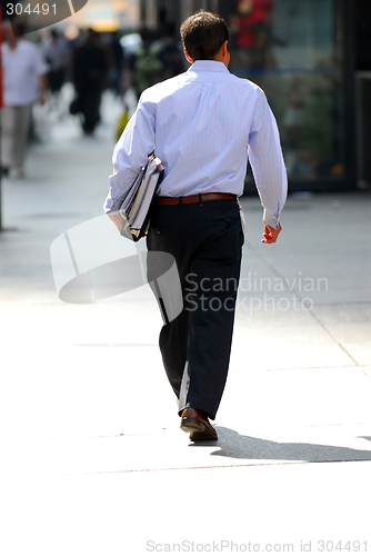 Image of Businessman walking