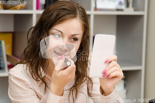 Image of Young girl in the office lipstick