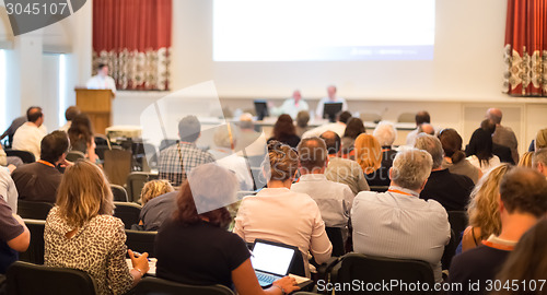 Image of Speaker at Business Conference and Presentation.