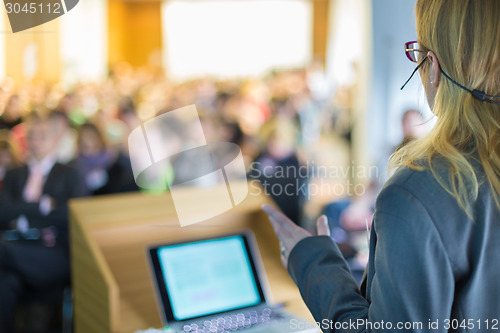 Image of Speaker at Business Conference and Presentation.