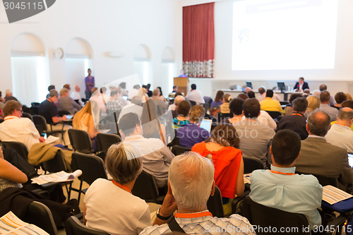 Image of Speaker at Business Conference and Presentation.