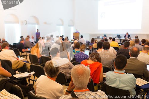 Image of Speaker at Business Conference and Presentation.